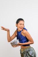 Portrait pretty woman in Songkran festival with water bowl photo