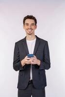 Portrait of a happy businessman using smartphone over white background photo