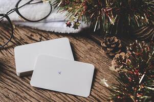 white sheet of paper lying among small decorations on  wooden desk. photo