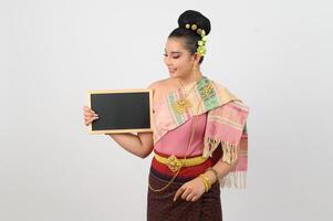 Young beautiful woman in northeastern dress holding chalkboard posting photo