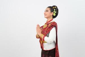 Portrait of Beautiful Thai Woman in Traditional Clothing Posing pay respect photo