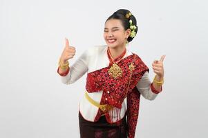 Young beautiful woman in Thai lanna costume with thumb up posture photo