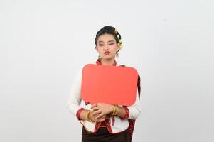 Young beautiful woman in Thai lanna costume with blank speech bubble sign photo