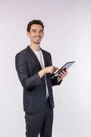 Portrait of attractive cheerful businessman using device app searching web isolated over white color background photo