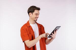 Portrait of attractive cheerful man using device app searching web isolated over white color background photo