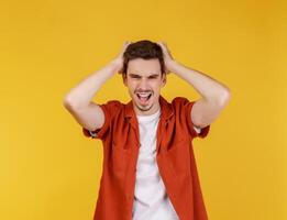 Portrait of thinking man surrounded by question mark on isolated background photo