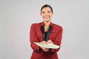 Young beautiful woman in formal clothing for officer with banknote in hands photo