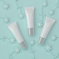 skin care products decorated with patterns on color background photo