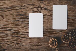 white sheet of paper lying among small decorations on  wooden desk. photo