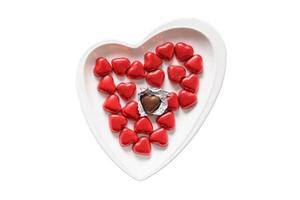 1532 White heart plate with chocolates isolated on a transparent background photo