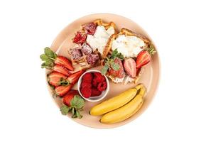 2058 Beige plate with desserts and fruits isolated on a transparent background photo