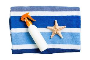 3496 Beach accessories, towel and bronzer isolated on a transparent background photo