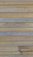 Bamboo slats arranged in a row alternating between dark and light colors. For background and textured. photo