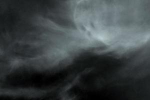 Textured cloud,Abstract black,isolated on black background photo