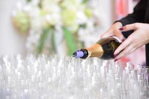 champagne glasses arranged on the table for wedding reception photo