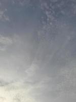 Beautiful white clouds on deep blue sky background. Large bright soft fluffy clouds are cover the entire blue sky. photo