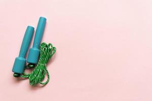 Sport, fitness equipment on pink background. Flat lay composition photo