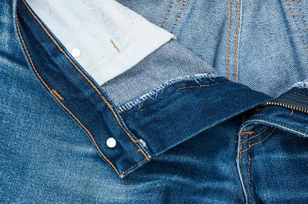 Close Up Shot Of Man In Jeans With Open Zipper. Unbuttoned Blue