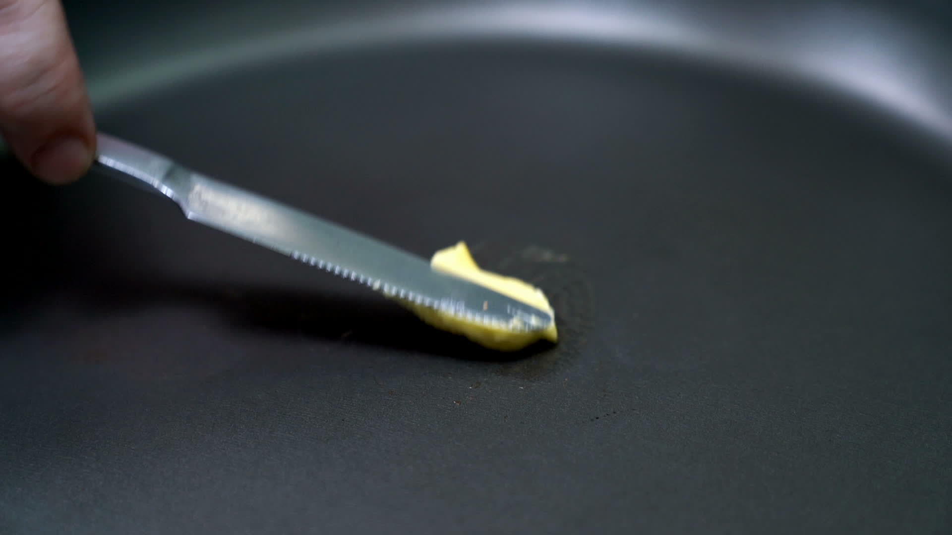 Butter in frying teflon pan for cooking,slow motion movement 20142900 Stock Video at Vecteezy