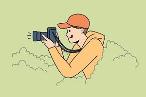 Smiling young man hide in bushes make pictures with professional camera. Happy guy journalist or reporter take photos from hidden spot. Vector illustration.