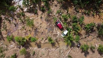 Aerial top down view car is trapped in mud after disaster flash flood video