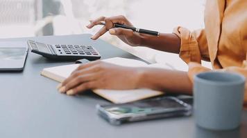 Financial analysts analyze business financial reports on a digital tablet planning investment project during a discussion at a meeting of corporate showing the results of their successful teamwork. video