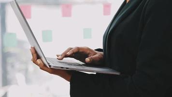 Financial analysts analyze business financial reports on a digital tablet planning investment project during a discussion at a meeting of corporate showing the results of their successful teamwork. video