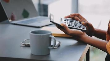 Financial analysts analyze business financial reports on a digital tablet planning investment project during a discussion at a meeting of corporate showing the results of their successful teamwork. video