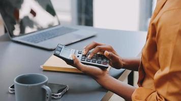 Financial analysts analyze business financial reports on a digital tablet planning investment project during a discussion at a meeting of corporate showing the results of their successful teamwork. video