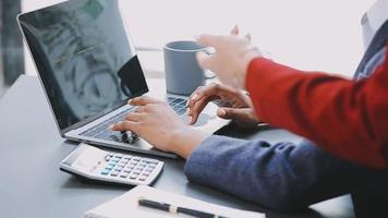 Financial analysts analyze business financial reports on a digital tablet planning investment project during a discussion at a meeting of corporate showing the results of their successful teamwork. video