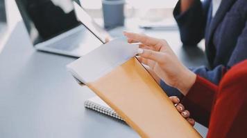 Financial analysts analyze business financial reports on a digital tablet planning investment project during a discussion at a meeting of corporate showing the results of their successful teamwork. video