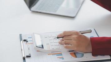 Financial analysts analyze business financial reports on a digital tablet planning investment project during a discussion at a meeting of corporate showing the results of their successful teamwork. video