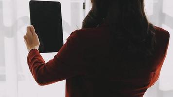 Financial analysts analyze business financial reports on a digital tablet planning investment project during a discussion at a meeting of corporate showing the results of their successful teamwork. video