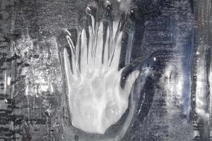 Hand on ice blocks wall photo