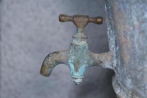 Vintage zinc tap faucet used for grape harvest and wine photo