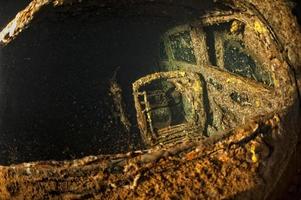 Old Car inside II world war ship wreck hold photo