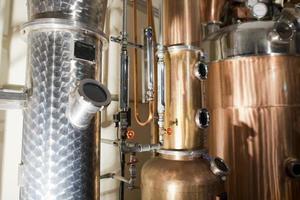 Copper still alembic inside distillery photo