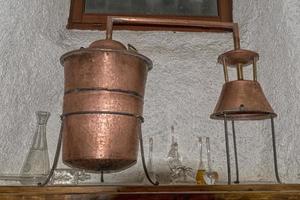 Copper still alembic inside distillery photo