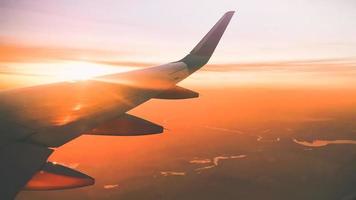 In plane flight view from window with stunning sunset background and copy paste background photo