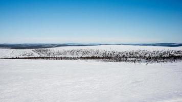 Nice landscape with snow, forest and no mountains photo