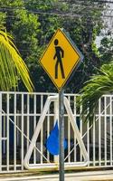 Yellow pedestrian sign street signin Playa del Carmen Mexico. photo