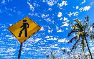 Yellow pedestrian sign street sign in Puerto Escondido Mexico. photo