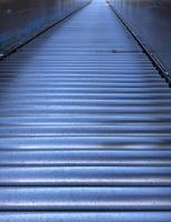 Conveyor belt inside a warehouse photo