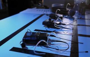 Clip-on microphones ready in the backstage area of a TV production photo