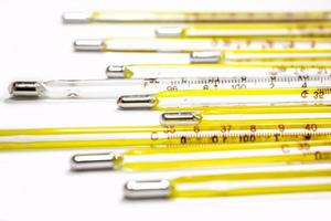 Closeup and crop small medical thermometers line up isolate on white background. photo