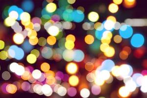 Abstract colorful bokeh and blurred reflection lighting on black background photo