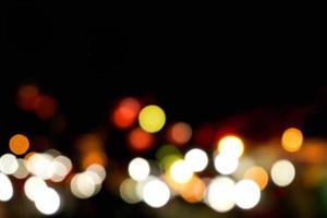 Abstract colorful bokeh and blurred reflection lighting on black background photo
