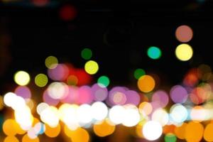 Abstract colorful bokeh and blurred reflection lighting on black background photo