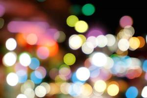 Abstract colorful bokeh and blurred reflection lighting on black background photo