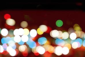 Abstract colorful bokeh and blurred reflection lighting on black background photo